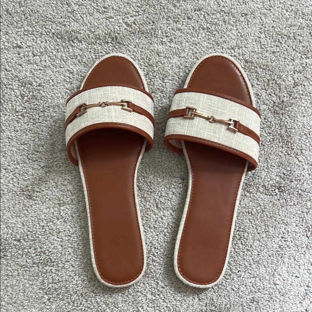Never worn tan/brown w/gold hardware. Size 44.